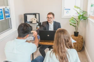 Man and woman discussing broker mortgage loan options in a modern office