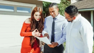 People reviewing mortgage documents outside a house while comparing mortgage loan offers