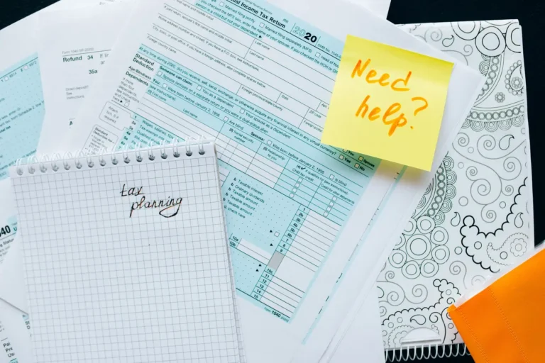 Tax documents and a note indicating tax planning or financial assistance needs