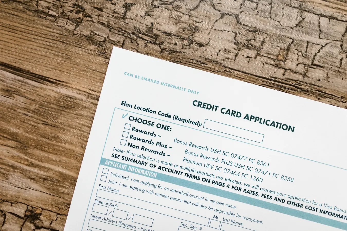 Top view of a credit card application form, relevant to credit cards for horrible credit