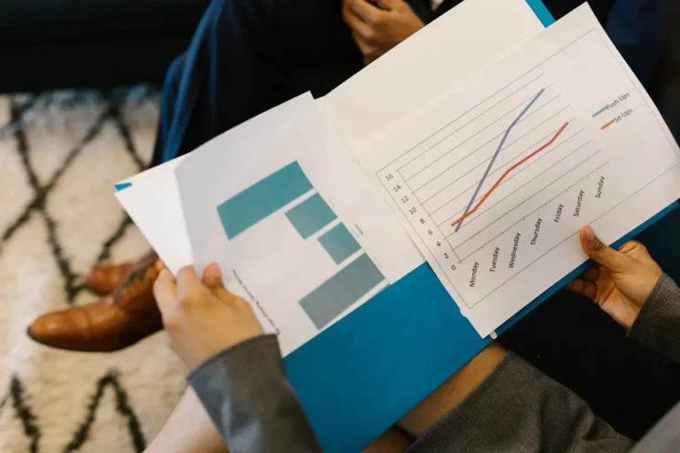 Business reports with graphs on a meeting table illustrating ESG investing risks