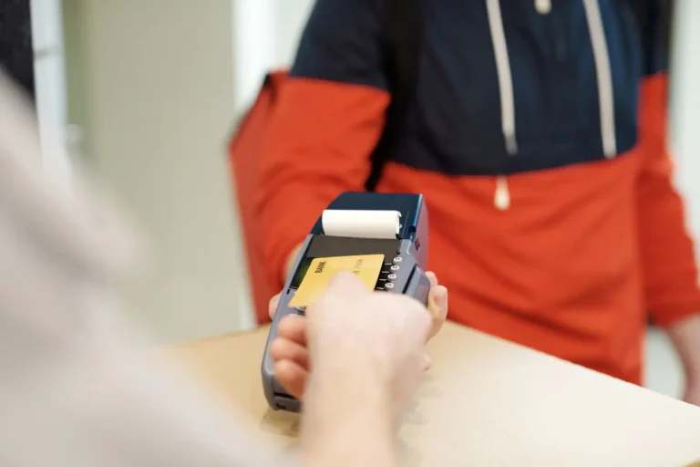 Close-up of a contactless credit card payment on a terminal in India