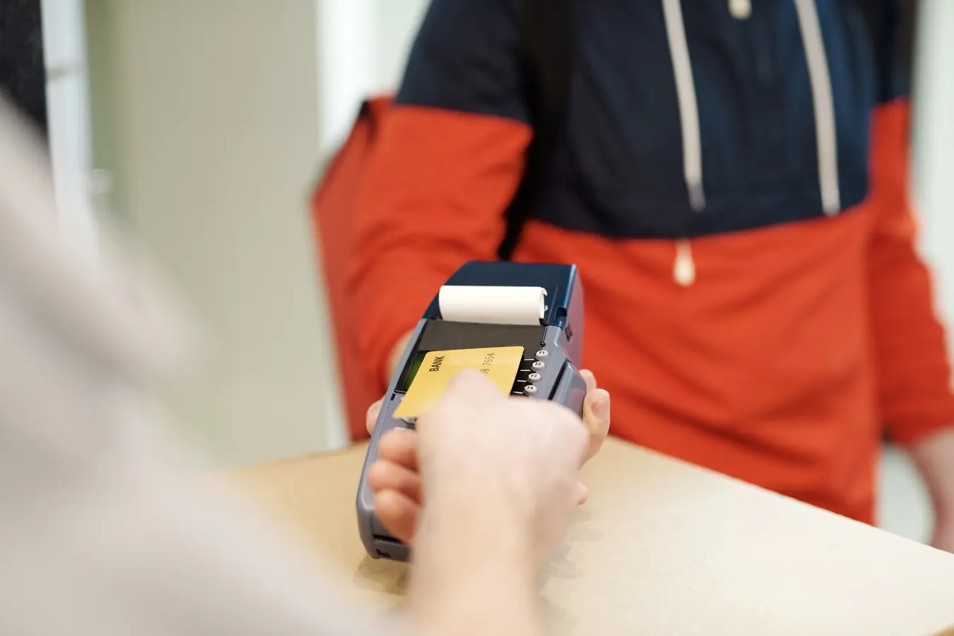 Close-up of a contactless credit card payment on a terminal in India