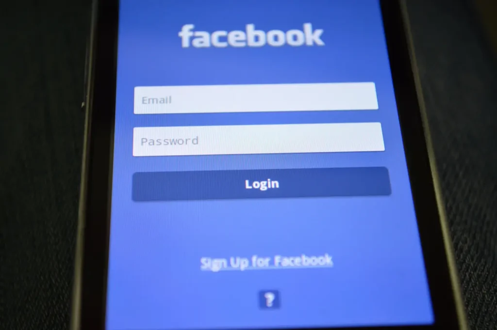 Close-up of a smartphone screen displaying the Facebook login page for secure account access