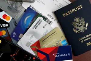 Passport, credit cards, and boarding pass arranged as travel essentials for premium credit card travel