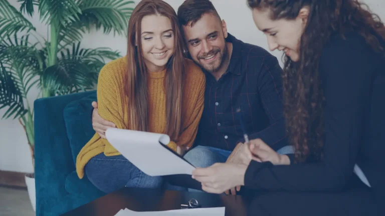 Couple discussing home loan options with financial advisor in a cozy office